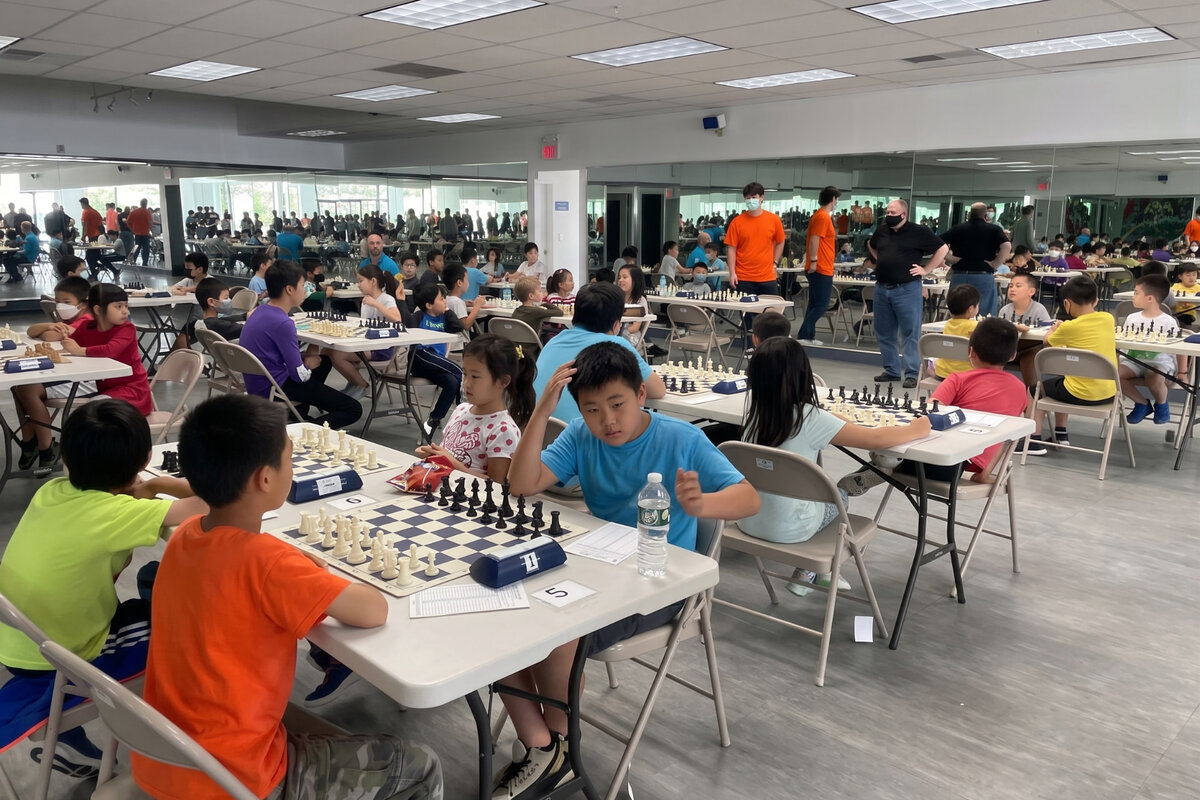 Players competing in a USCF-rated scholastic quad chess tournament at Chess in Millburn Academy in Millburn, NJ